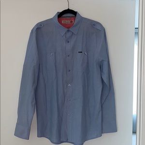 Blue Oxford style shirt.